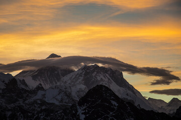 Picturesque colourful clouds over Mount Everest at sunrise. No people.