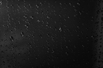 Rain texture drops on glass black background