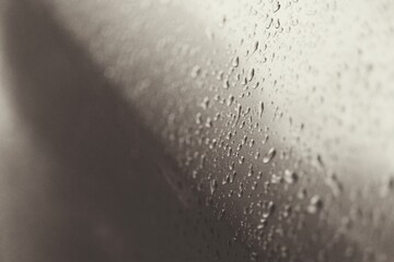 Rain drops on a gray background.