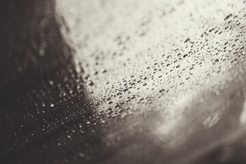 Rain drops on a gray background.