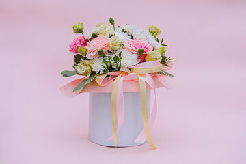 Bouquet of flowers: roses, eucalyptus, daisies, peonies in a round box hat. Composition gift vase of flowers for Valentine's day, mother's day, wedding, birthday.