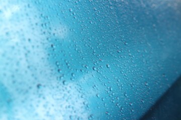 Rain texture drops on blue background