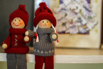 Christmas Time. Two Christmas Decorations In The Form Of A Boy And A Girl.