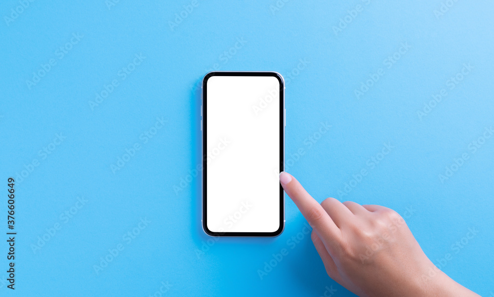 Poster hand touching on phone white screen on blue background clipping path inside