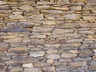 A texture of a irregular stone wall