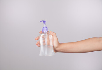 Girl, who has a sanitizer gel to fight the coronavirus.