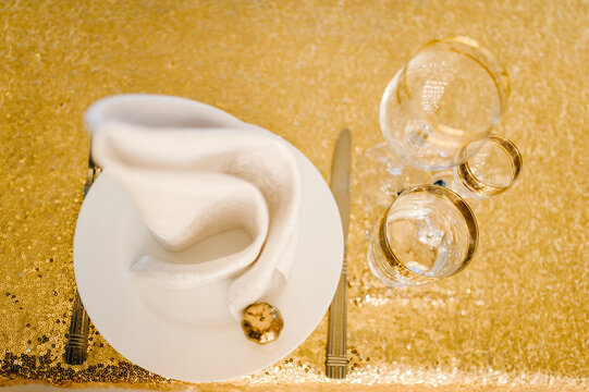 Luxury Elegant Table Setting Dinner In A Restaurant. Selective Focus On Glasses. Banquet Table In The Restaurant. Gold Wedding Reception With Small Pumpkin. Autumn Style. Top View. Flat Lay.