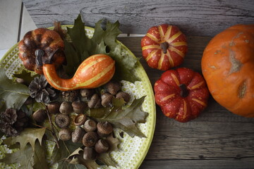 Autumn Background With Pumpkins, Fallen Maple Leaf, Nuts On Wooden Background. Concept Of Thanksgiving Day Background, Halloween Background, Fall Harvest