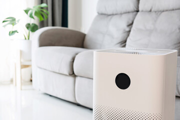 Closeup of air purifier in living room for wellbeing breathing fresh air while dust air pollution...