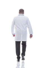 rear view. confident male doctor stepping to the rescue