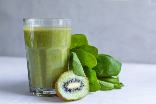 healthy fresh natural green smoothie in glass. Made from spinach, kiw. Detox day.
