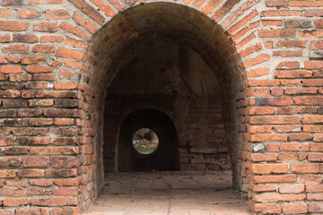 The door was built with orange or burnt-like bricks.