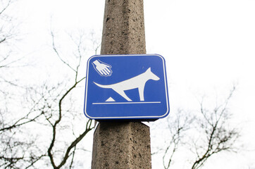 Clean after your dog sign. Sign requiring dog owners to pick up the animal waste.