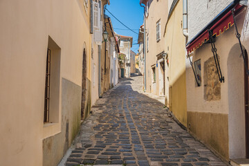 Narrow street and old houses in the old town of Krk on the island of Krk in Croatia
