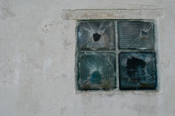 Broken glass in old building. Wall pattern.