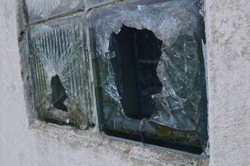 Broken vintage window on white wall