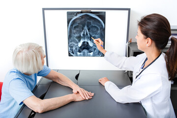 Doctor consider and discuss with senior patient X-ray of her head and maxillary sinuses....