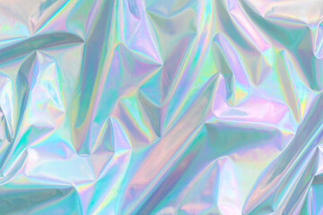 Abstract Modern pastel colored holographic background in 80s style. Crumpled iridescent foil...