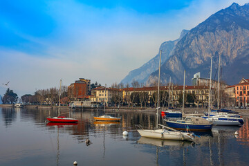 Lecco, Italy, February 16, 2020. The picturesque embankment of Lake Como in cloudy weather and the...