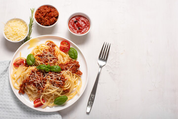 spaghetti with meat sauce, parmesan and basil