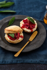 Traditional British Scones with clotted cream, raspberry jam. Scones with raspberry jam