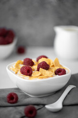 cornflakes with milk and raspberries
