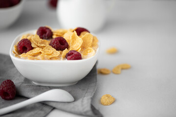 cornflakes with milk and raspberries