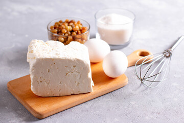 Products for the preparation of casserole cottage cheese. Eggs, cottage cheese, raisins, sugar. Copyspace.
