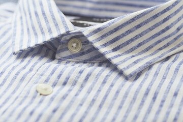 Close up of men's striped shirt.	