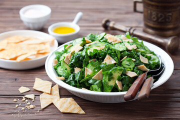 Paleo Fattouche Salad with gluten free flat bread, selective focus