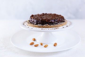 Chocolate almond cake on a light background. Sugar, lactose, gluten free.