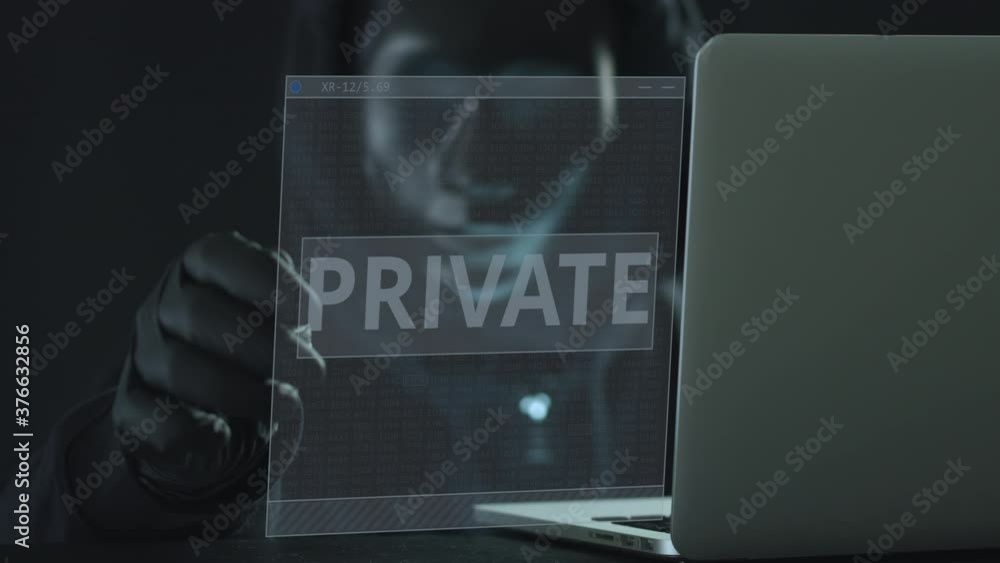 Aufkleber hacker wearing black mask pulls private tab from a laptop. hacking concept