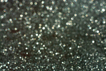 white bokeh abstract on a gray background, the concept of Christmas, new year, 2021.