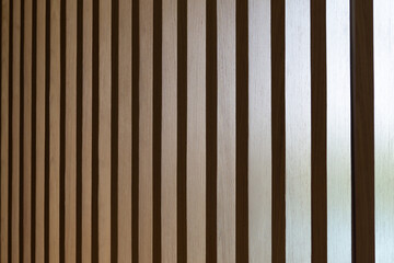 Seamless pattern of modern wall covering with light brown wooden slats.