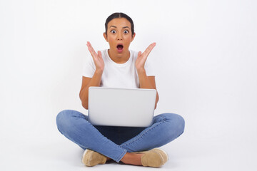 Surprise concept. Portrait of astonished beautiful girl looking surprised in full disbelief wide open mouth with hands near face with braided hair. Positive emotion facial expression body language.