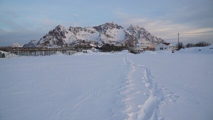 Cold white winter mountain landscapes seen from the Henningsvaer Stadium on the Lofoten Island, Norway.