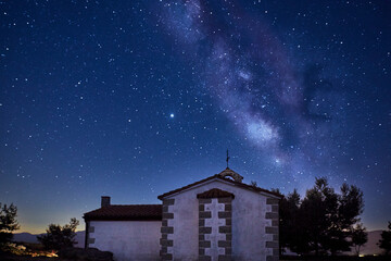 View of the Milky Way over a small chapel. Concept science