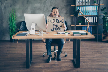 His he fired miserable depressed desperate poor agent broker guy holding in hands promo placard...