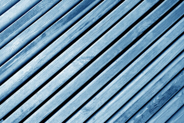 Weathered wooden planks texture with gaps. blue toned