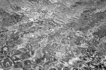 Water pattern in swimming pool in black and white
