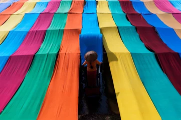  Lotusbloem Handmade multicolored lotus cloth made from lotus threads in Inle Lake, Shan State in Myanmar. A beautiful woman making a cloth for the morning light  © songpol