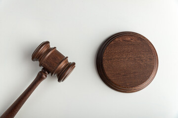 Wooden judge gavel and sound Board. Top view. Auction. White background