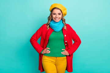 Portrait of nice attractive lovely pretty girl enjoy season winter walk put hands waist wear bright clothes isolated over teal color background