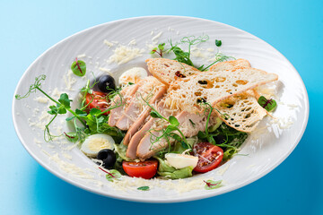 Caesar salad on a blue background