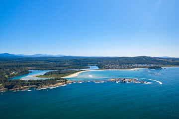 Panoramic aerial view of the beautiful Tomakin Beach and inlet to Tomaga River at Tomakin on the New South Wales South Coast, Australia 