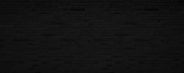 Abstract Black Brick Wall Texture Background. Weathered Brickwork Design Backdrop. Wide Panorama Picture.