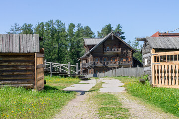 entrance to the village farmstead with a two-story house