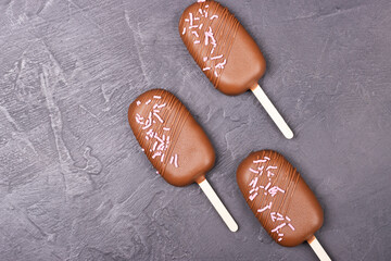 Ice cream in chocolate on a stick