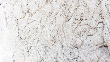 White cement wall background in vintage style for graphic design or wallpaper. Pattern of soft concrete floor in retro concept.