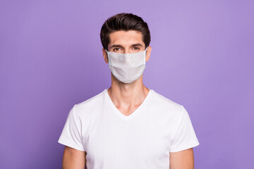 Close-up portrait of his he nice attractive healthy content guy sales manager wearing safety mask stop flu grippe pandemia disease sickness illness isolated lilac violet purple pastel color background